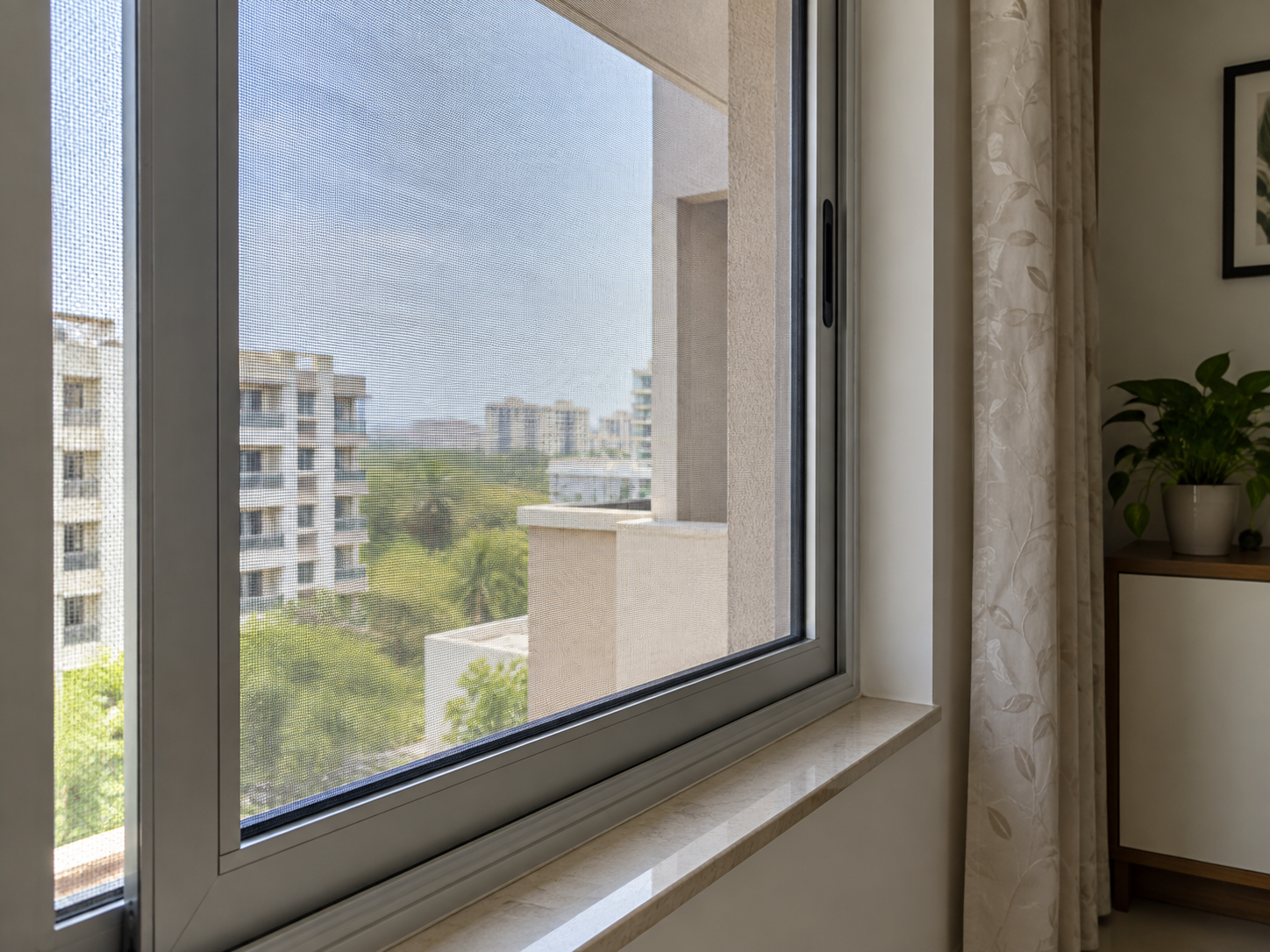 Pleated mosquito mesh fitted to a window in Hyderabad